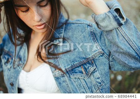 Summer portrait of attractive young freckled woman Summer portrait of attractive young freckled woman 68984441