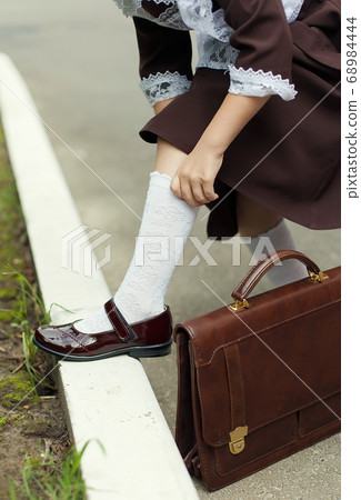 White cotton socks on children's feet. School uniform. Education White cotton socks on children's feet. School uniform. Education 68984444