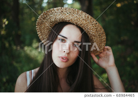 Summer portrait of attractive young freckled woman Summer portrait of attractive young freckled woman 68984465