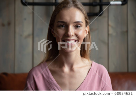 Head shot portrait smiling beautiful woman looking at camera 68984621