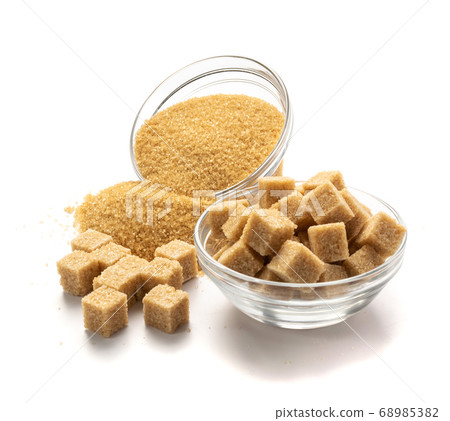 Raw Brown Cane Sugar Isolated on White Background Raw Brown Cane Sugar Isolated on White Background 68985382