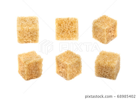 Raw Brown Cane Sugar Cubes Isolated on White 68985402