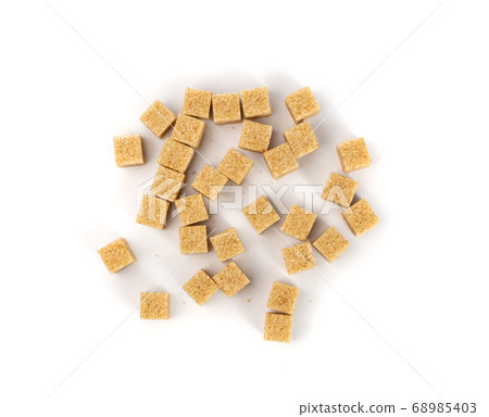 Raw Brown Cane Sugar Cubes Isolated on White Raw Brown Cane Sugar Cubes Isolated on White 68985403