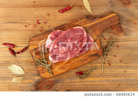 Raw Lamb Chops, Mutton Cuts or Sheep Ribs on Wood Raw Lamb Chops, Mutton Cuts or Sheep Ribs on Wood 68985614