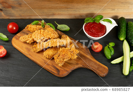Breaded Deep Fried Fish Nuggets on Wooden Rustic 68985827