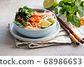 Bun Bo Hue, Bun Bo, Vietnamese beef noodle soup spicy. bowl of beef and rice vermicelli soup, vietnamese noodle cuisine in Hue 68986653