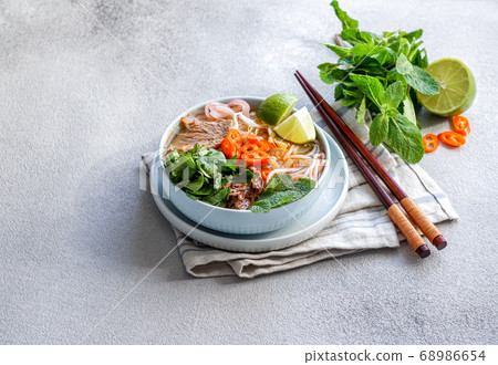 Bun Bo Hue, Bun Bo, Vietnamese beef noodle soup spicy. bowl of beef and rice vermicelli soup, vietnamese noodle cuisine in Hue 68986654