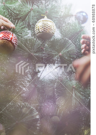 Decorating Christmas Tree Inside Home 68988878