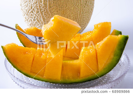 Yubari's sweet red meat melon, studio shot Yubari's sweet red meat melon, studio shot 68989866