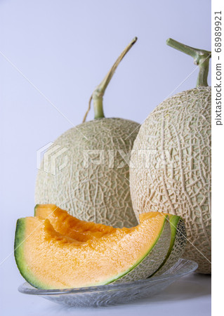 Yubari's sweet red meat melon, studio shot Yubari's sweet red meat melon, studio shot 68989921