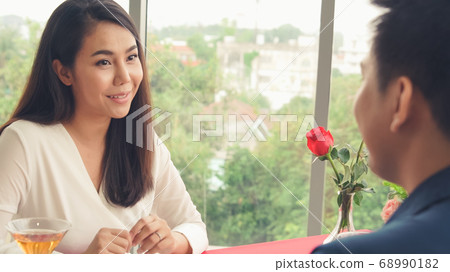 Happy romantic couple eating lunch at restaurant Happy romantic couple eating lunch at restaurant 68990182