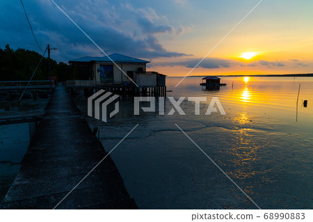 Scenic sunset at Kuala Sepetang, fisherman 68990883