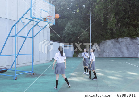 Junior high school student playing basketball Junior high school student playing basketball 68992911