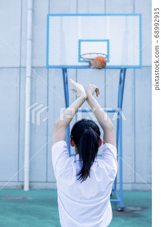 Junior high school student playing basketball 68992915