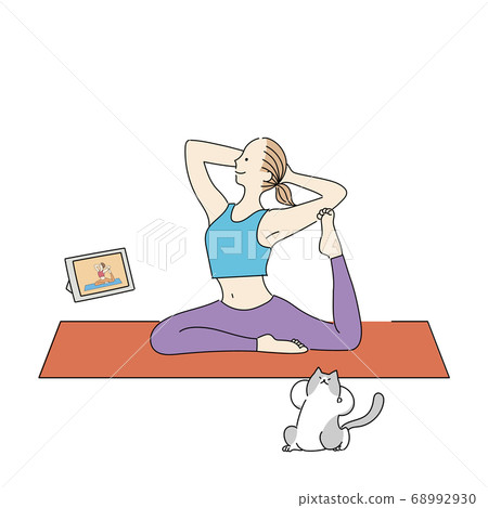 Woman taking a yoga lesson online and a cat pigeon pose Woman taking a yoga lesson online and a cat pigeon pose 68992930