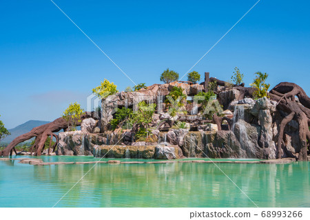 landscape of beautiful Artificial waterfall in garden at the public park 68993266