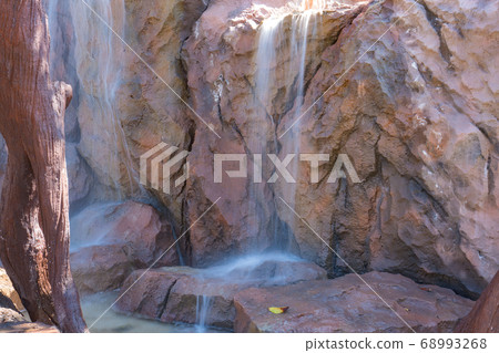 landscape of beautiful Artificial waterfall in garden at the public park 68993268