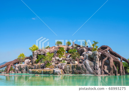 landscape of beautiful Artificial waterfall in garden at the public park landscape of beautiful Artificial waterfall in garden at the public park 68993275