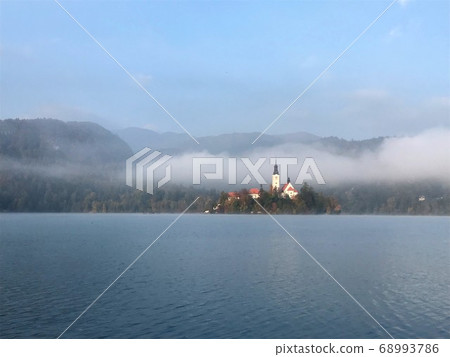 Lake Bled in the morning haze Lake Bled in the morning haze 68993786