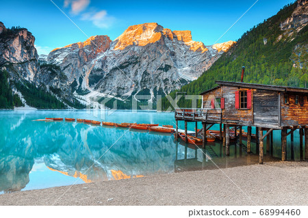 Spectacular wooden boathouse on the alpine lake, Dolomites, Italy, Europe 68994460