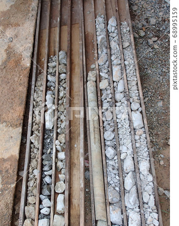 Soil test sample is recorded by category on construction site before sent to the laboratory. 68995159