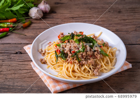 stir fried spicy spaghetti with minced pork and basil 68995979