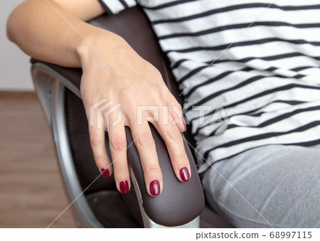 Business girl sitting on a chair on a white Business girl sitting on a chair on a white 68997115