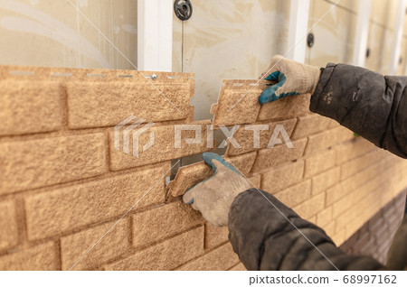 Installation of plastic siding under the brick Installation of plastic siding under the brick 68997162
