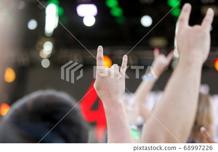 Two fingers on the hand at the concert 68997226