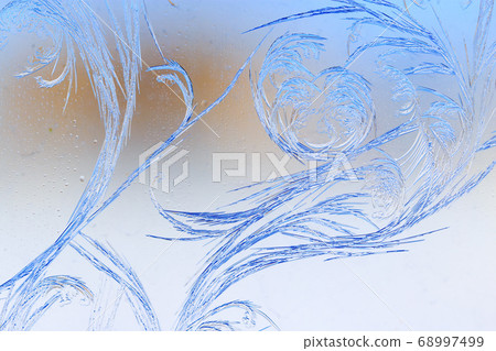 Snow patterns on glass as an abstract background Snow patterns on glass as an abstract background 68997499