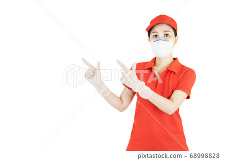 Staff,Asian Delivery in red uniform isolated on white background.Courier in protective mask and medical gloves,concept delivers service under quarantine 68998828