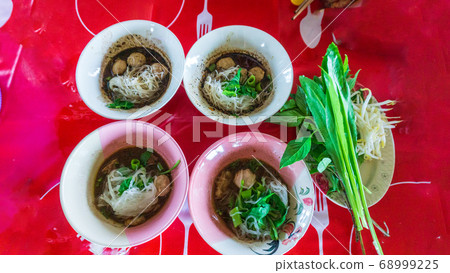 Thai style noodle soup with vegetable Thai style noodle soup with vegetable 68999225