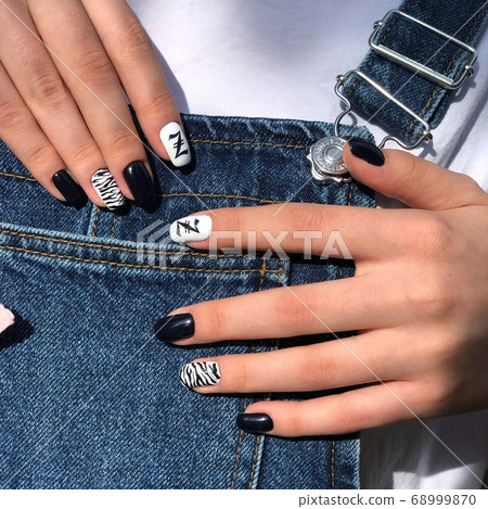 Woman with flesh-colored manicure with design, Woman with flesh-colored manicure with design, 68999870