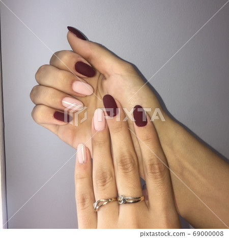 Manicure of different colors on nails. Female Manicure of different colors on nails. Female 69000008