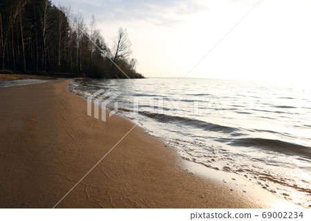Beautiful clean sea beach at sunset time. 69002234