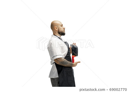 Portrait of a male chef cook, butcher isolated on a white studio background 69002770