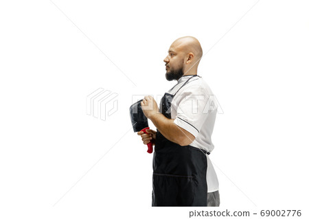 Portrait of a male chef cook, butcher isolated on a white studio background Portrait of a male chef cook, butcher isolated on a white studio background 69002776