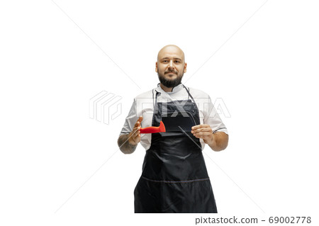 Portrait of a male chef cook, butcher isolated on a white studio background 69002778