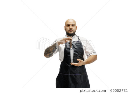Portrait of a male chef cook, butcher isolated on a white studio background 69002781