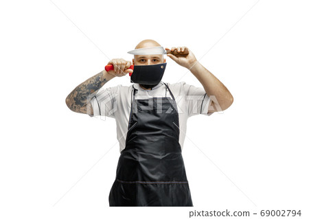 Portrait of a male chef cook, butcher isolated on a white studio background 69002794
