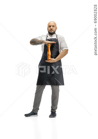Portrait of a male chef cook, butcher isolated on a white studio background 69002828