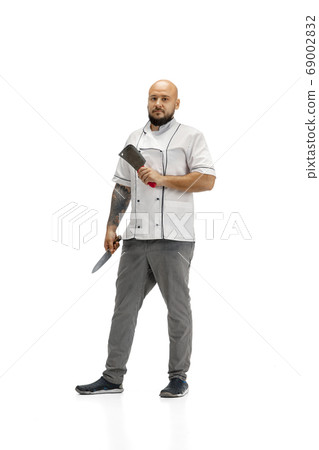 Portrait of a male chef cook, butcher isolated on a white studio background 69002832