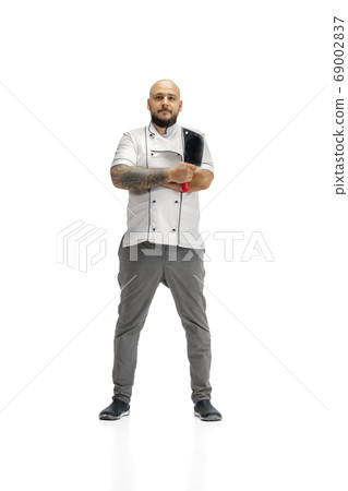 Portrait of a male chef cook, butcher isolated on a white studio background 69002837