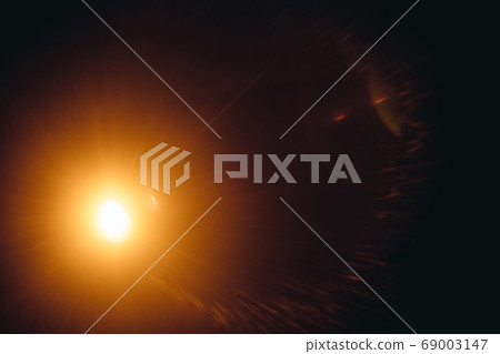 Abstract Natural Sun flare on the black Abstract Natural Sun flare on the black 69003147