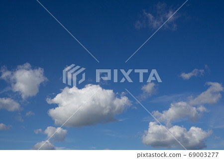 Blue summer sky white cumulus clouds background Blue summer sky white cumulus clouds background 69003277