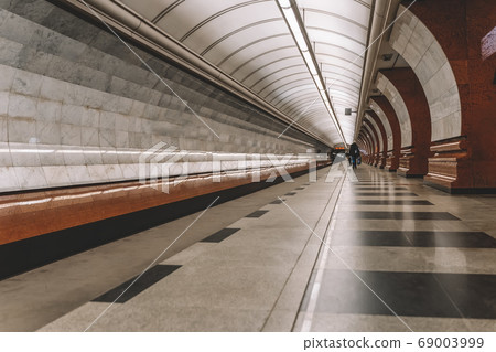Long platform of underground, station interior. 69003999