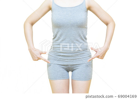 The body of young woman wearing gray clothes,Her hand pointing to crotch isolated on white background,health care concept 69004169