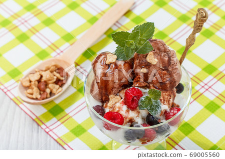 Chocolate and white ice cream in a glass with 69005560