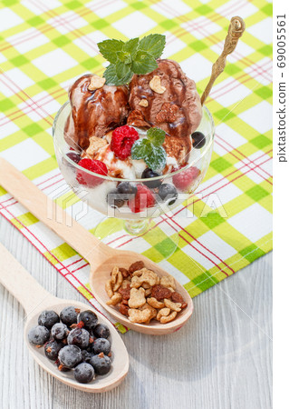 Chocolate and white ice cream in a glass with 69005561
