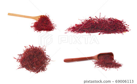 saffron threads and wooden spoon an isolated on 69006113